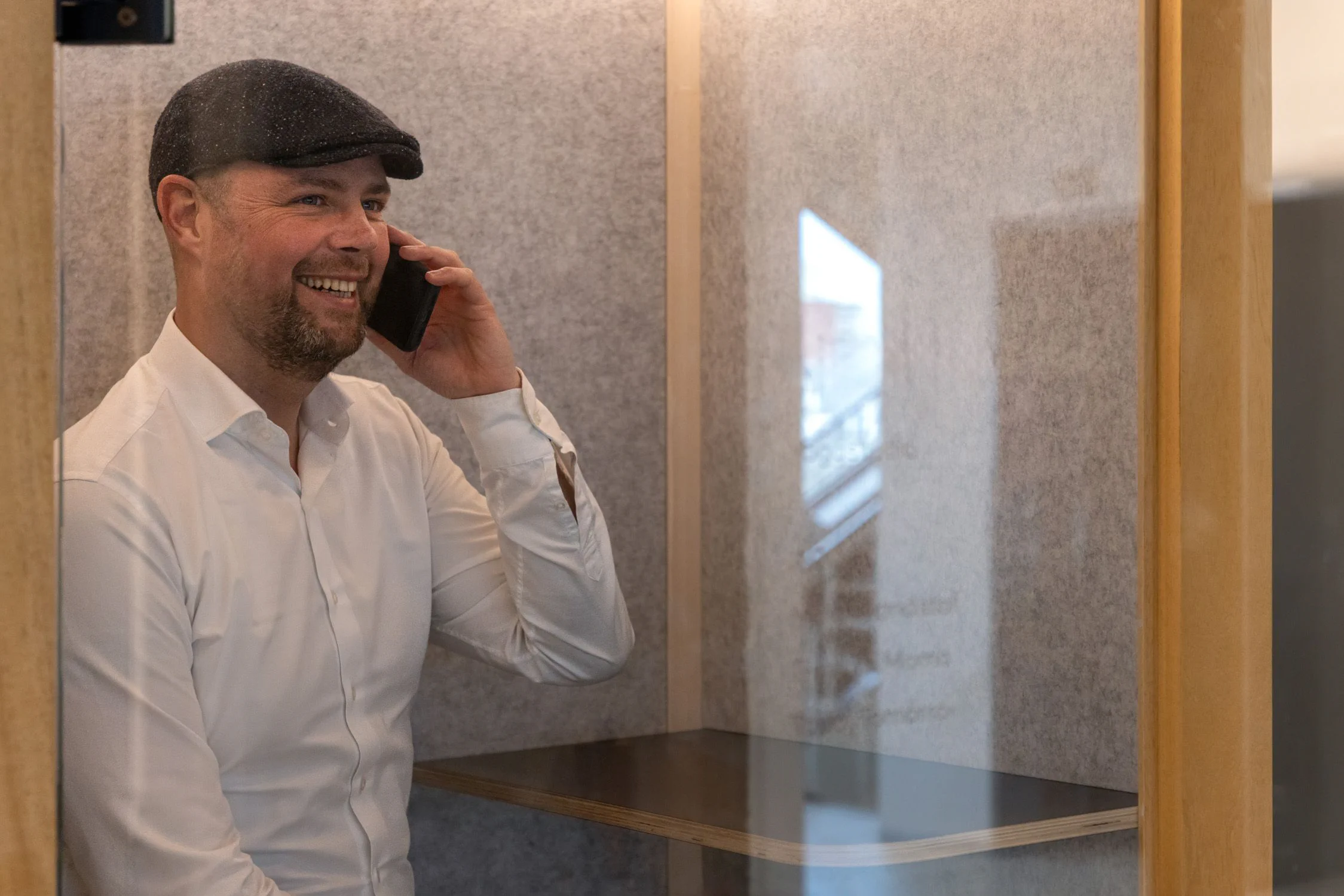 Respellion man calling in phone booth